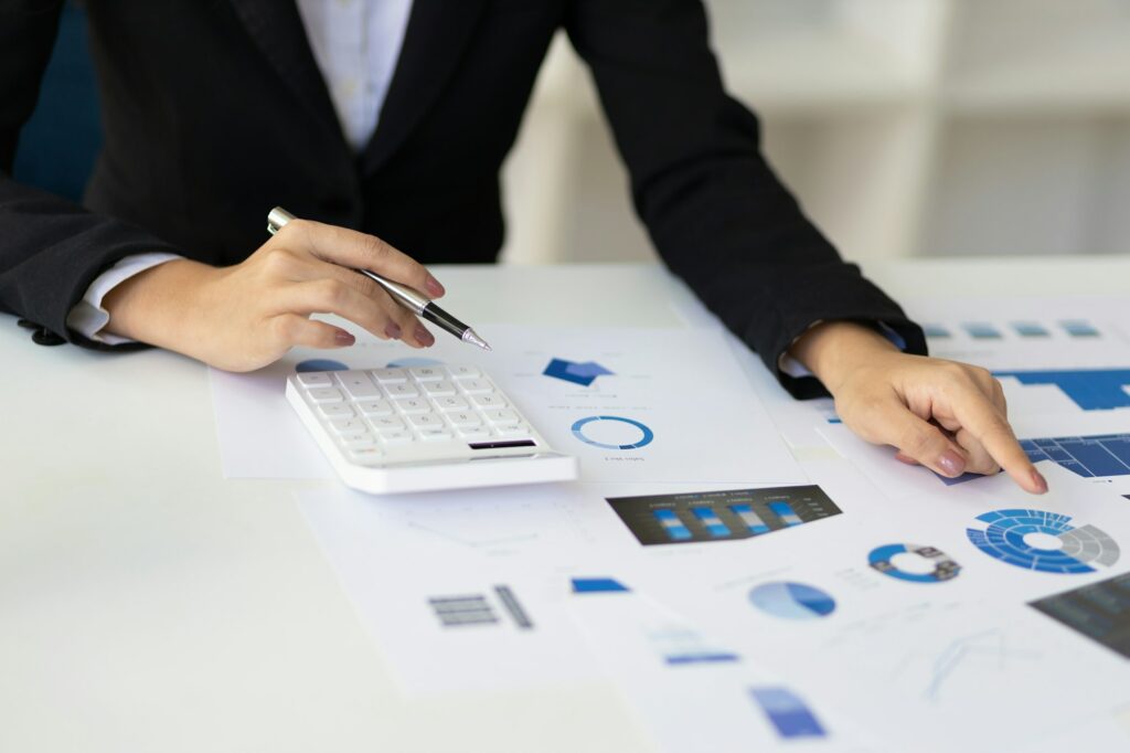 Businesswoman working with documents and analyzing business investment and financial accounting.